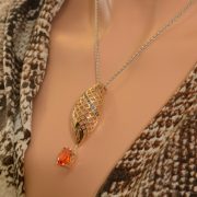 9ct yellow and white gold pendant with zincite and sapphire