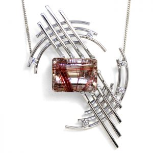 18ct white gold pendant with red rutilated quartz and diamonds