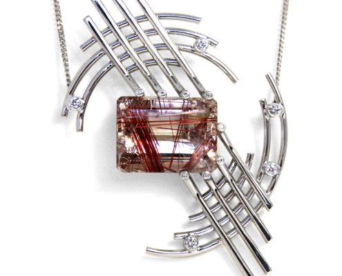 18ct white gold pendant with red rutilated quartz and diamonds