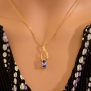 18ct yellow and white gold pendant with marquise tanzanite and diamond