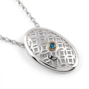 sterling silver oval pendant with blue diamond