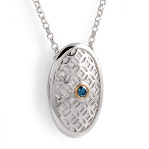sterling silver oval pendant with blue diamond