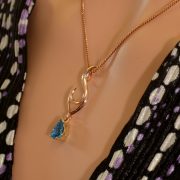 9ct rose and yellow gold pendant with blue topaz