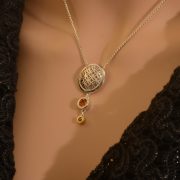 sterling silver domed circle pendant with citrine and green diamond